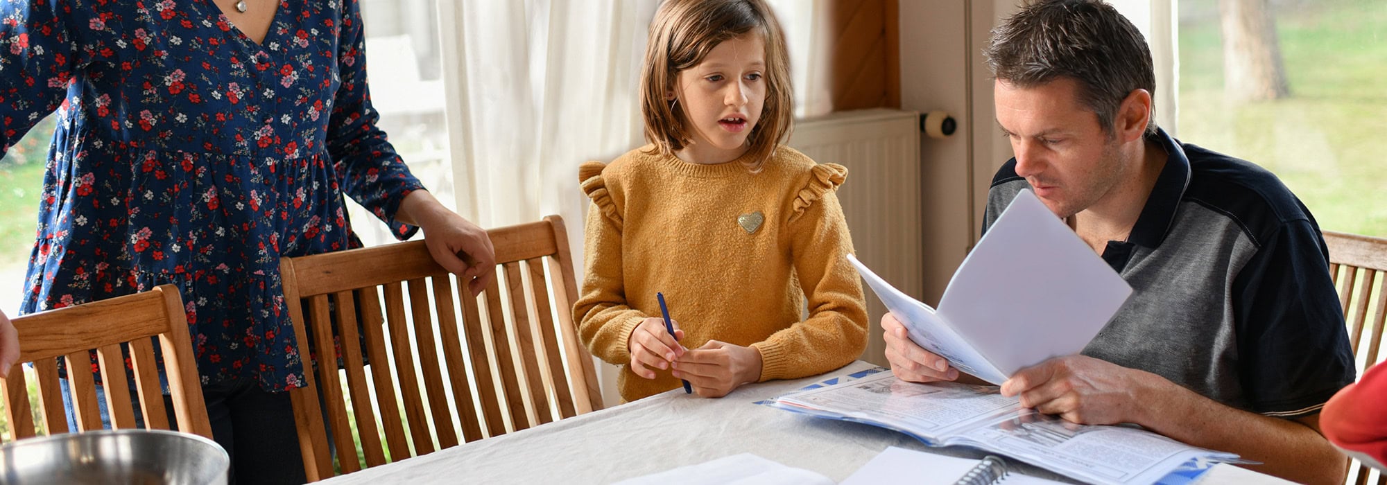 Man at table reviewing papers