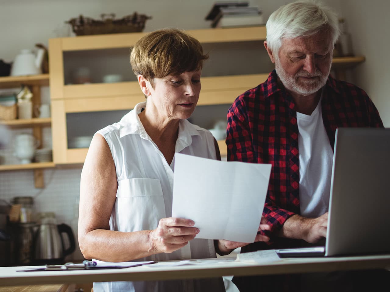 Older couple reviewing paperwork