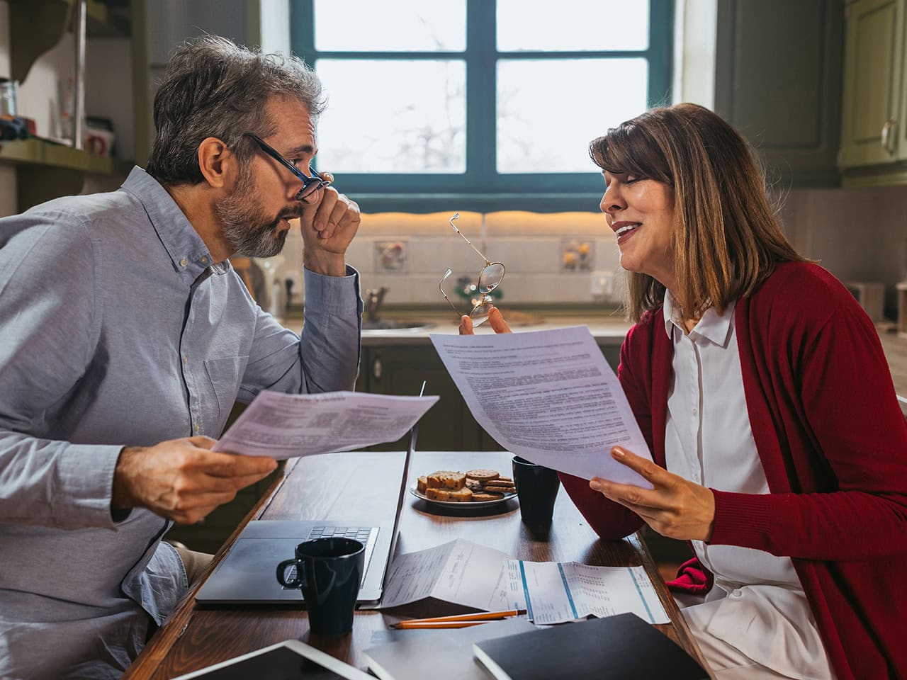 Older couple reviewing bills and expenses