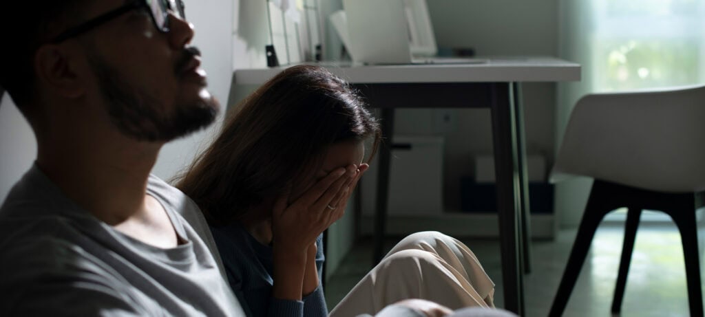 woman crying with partner