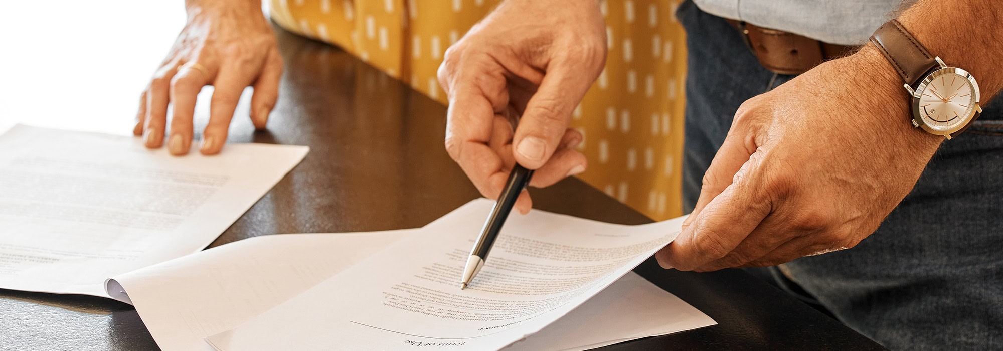 two adults reviewing paperwork