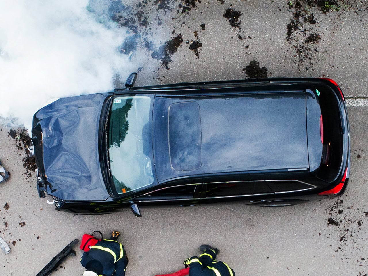 Car accident scene with medics and firefighters